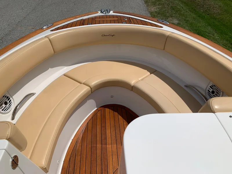 Slide: The Image of Luxurious 2012 Chris-Craft Launch 28 boat with elegant tan seating and wooden deck. - 24
