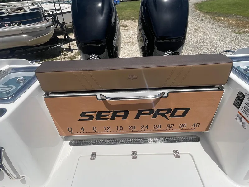 Slide: The Image of 2025 Sea Pro 292 Offshore boat with dual engines and branded seating. - 15