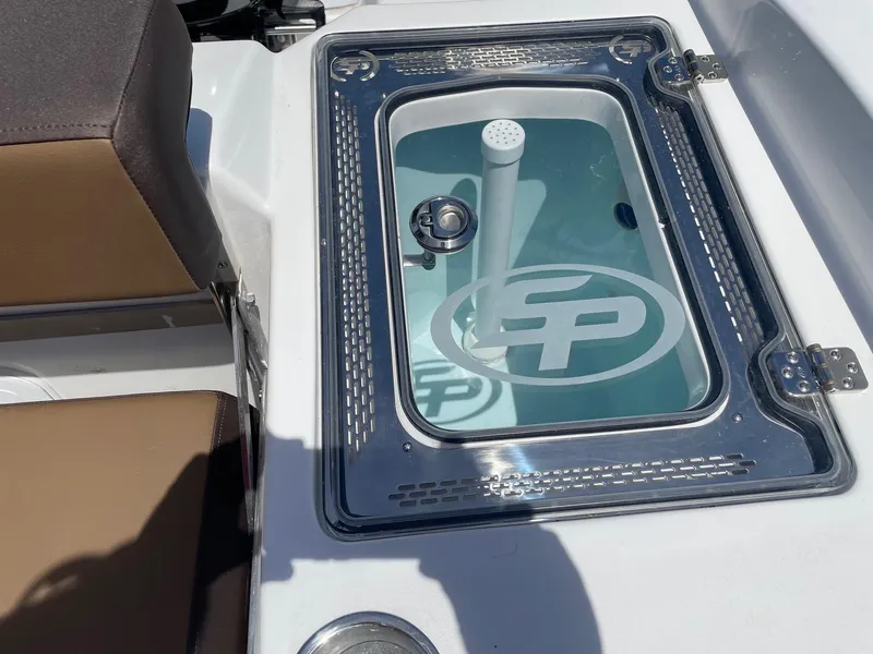 Slide: The Image of Livewell on 2025 Sea Pro 292 Offshore boat, featuring clear lid and seating area. - 18