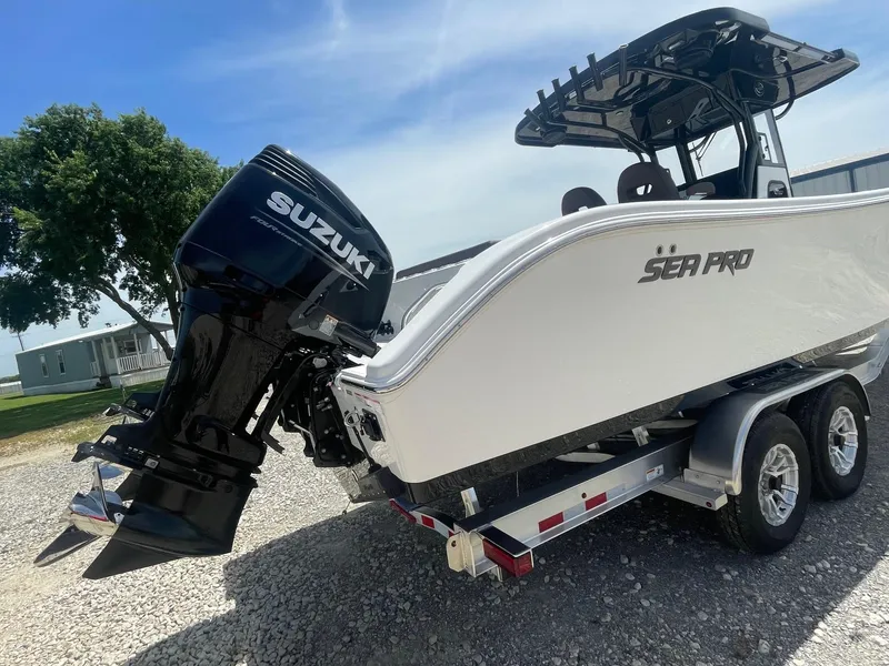 Slide: The Image of 2025 Sea Pro 292 Offshore boat on trailer with Suzuki outboard motor. - 4