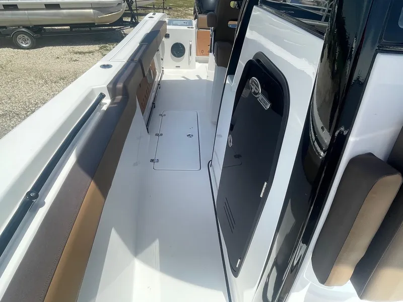 Slide: The Image of 2025 Sea Pro 292 Offshore boat deck with seating and storage compartments. - 8