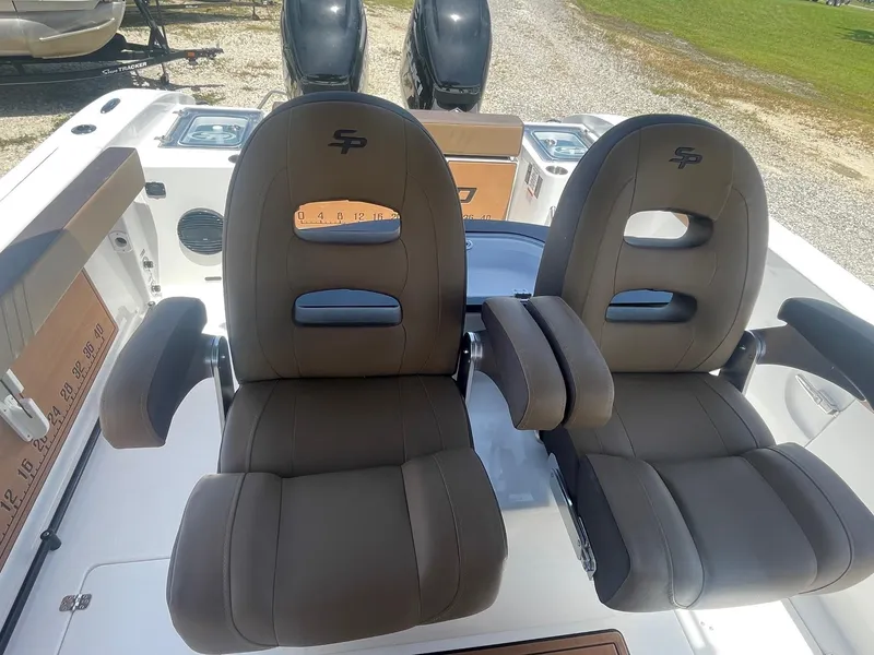 Slide: The Image of 2025 Sea Pro 292 Offshore boat seats, featuring dual cushioned chairs with armrests. - 12