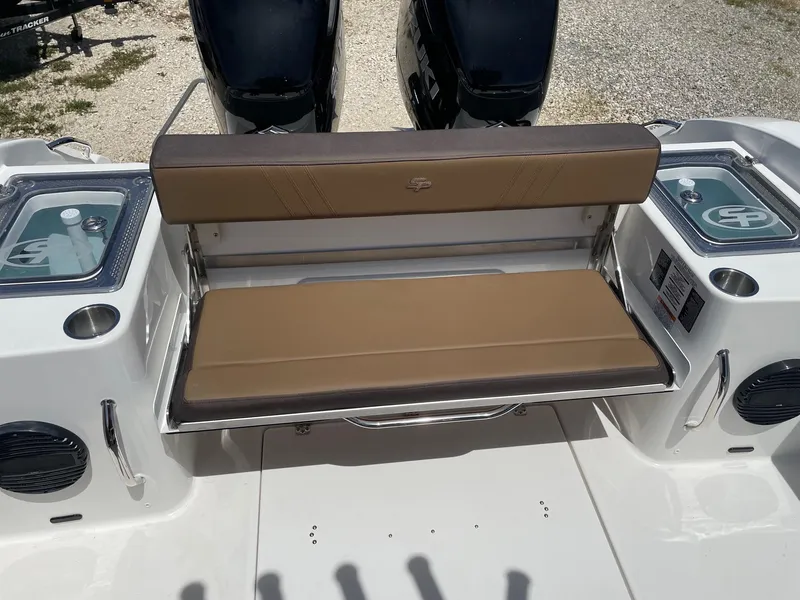 Slide: The Image of 2025 Sea Pro 292 Offshore boat with tan seating and dual engines. - 16