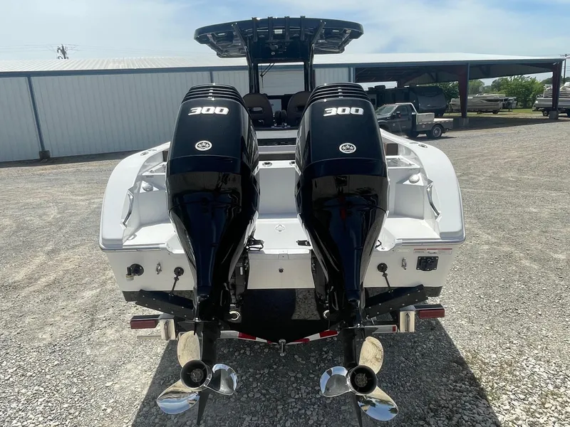 Slide: The Image of 2025 Sea Pro 292 Offshore boat with dual 300 horsepower engines, rear view. - 5