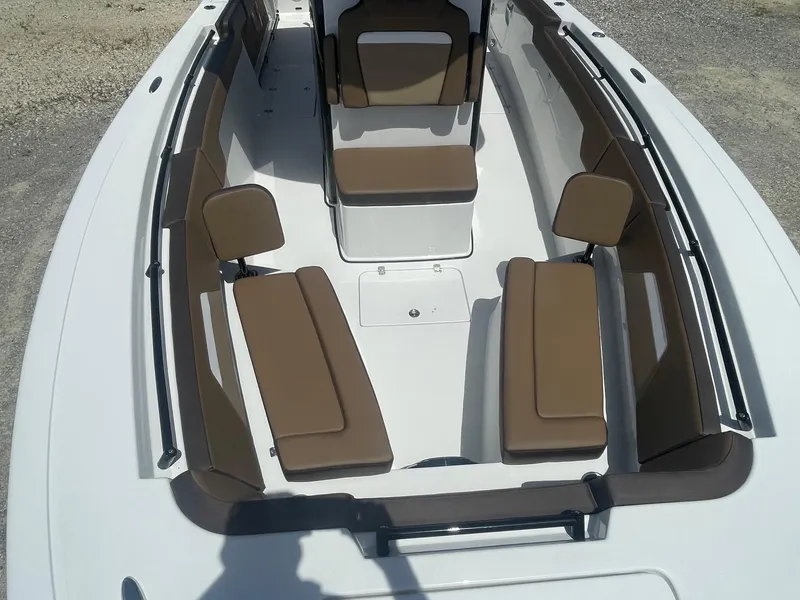 Slide: The Image of 2025 Sea Pro 292 Offshore boat interior with brown seating and spacious layout. - 7