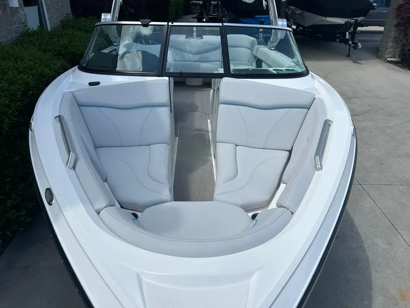 Slide: The Image of 2018 MasterCraft XT23 boat with white interior and sleek design. - 3