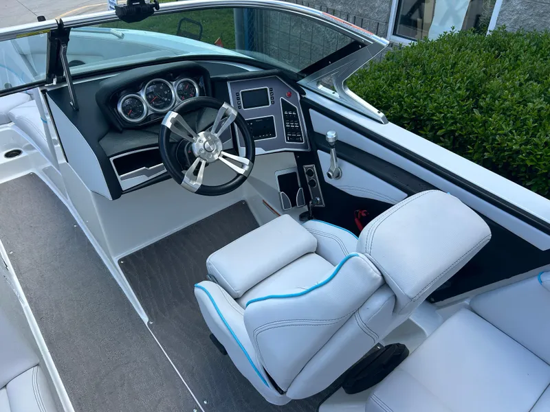 Slide: The Image of 2018 MasterCraft XT23 boat cockpit with modern steering and dashboard controls. - 6