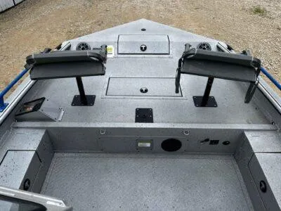 Slide: The Image of 2025 SeaArk ProCat 240 boat interior with two adjustable seats and storage compartments. - 9