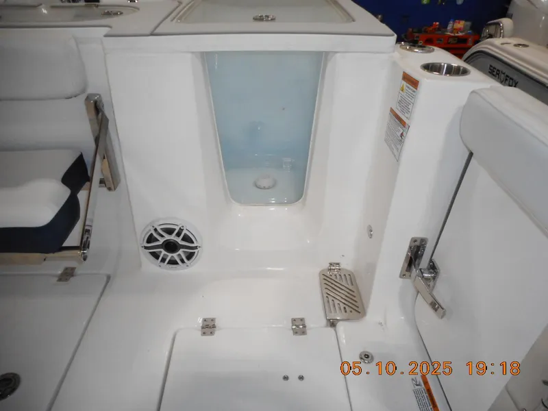 Slide: The Image of Interior view of 2025 Sea Fox 328 Commander boat, featuring seating and storage areas. - 19
