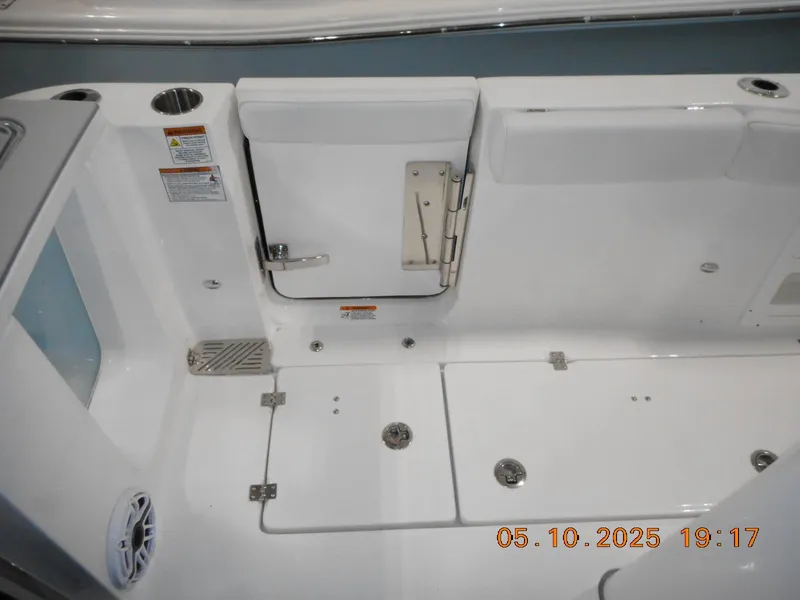 Slide: The Image of 2025 Sea Fox 328 Commander boat deck with storage compartments and safety features. - 21