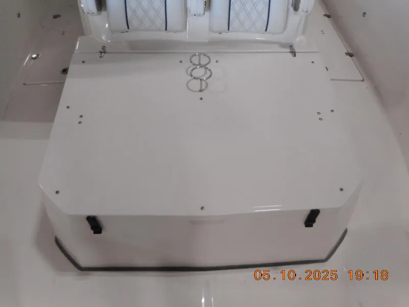 Slide: The Image of 2025 Sea Fox 328 Commander boat interior with seating and storage area. - 23