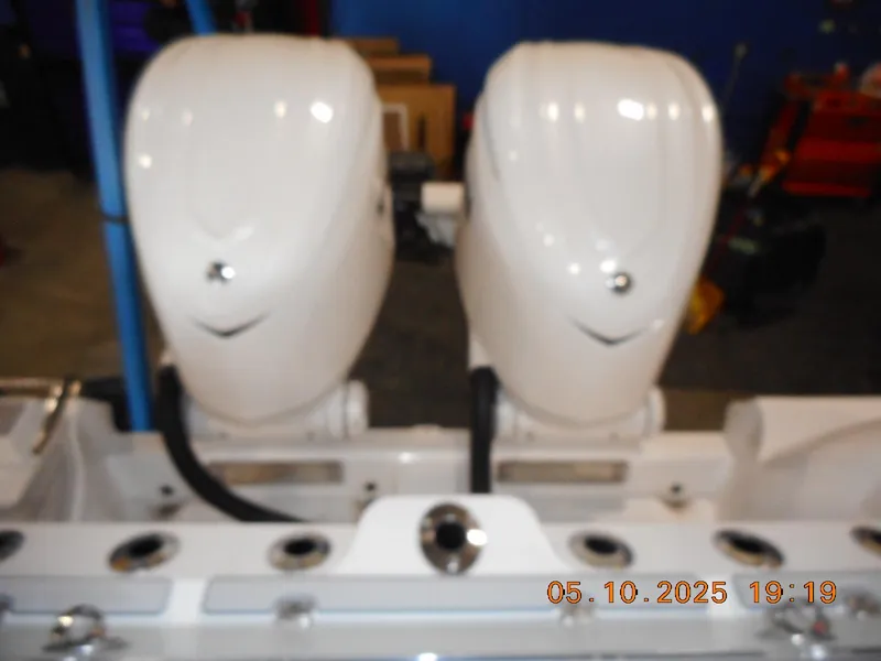 Slide: The Image of Twin outboard motors on a 2025 Sea Fox 328 Commander boat. - 26