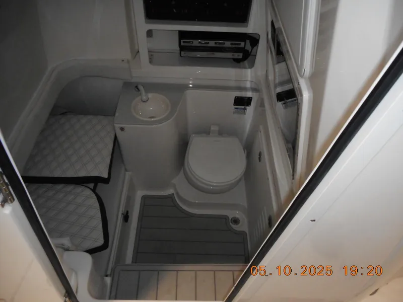 Slide: The Image of Interior of 2025 Sea Fox 328 Commander boat bathroom with toilet and sink. - 30