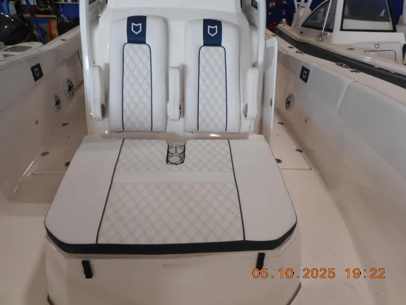 Slide: The Image of 2025 Sea Fox 328 Commander boat interior with white cushioned seating. - 33