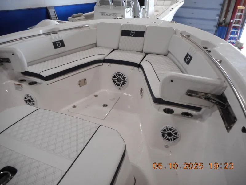 Slide: The Image of 2025 Sea Fox 328 Commander boat interior with cushioned seating and speakers. - 34
