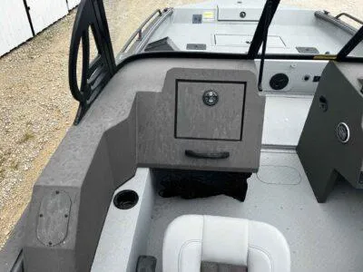 Slide: The Image of 2025 SeaArk ProCat 240 boat interior with storage compartment and seating. - 10