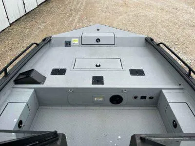 Slide: The Image of 2025 SeaArk ProCat 240 boat interior with storage compartments and seating. - 8