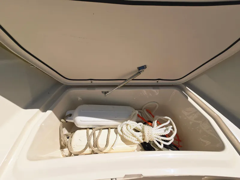 Slide: The Image of Storage compartment of 2023 Grady-White Fisherman 180 boat with ropes and equipment. - 14
