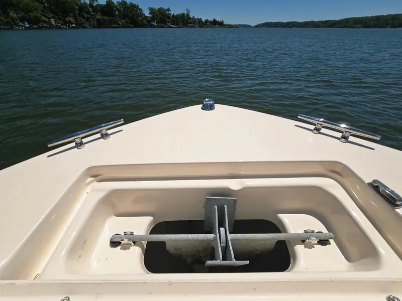 Slide: The Image of Bow of 2023 Grady-White Fisherman 180 boat on a calm lake. - 15