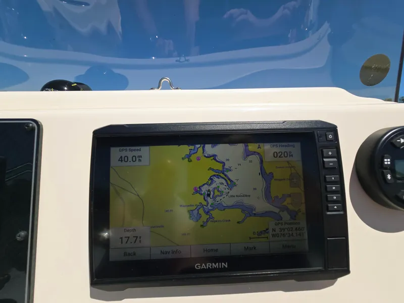 Slide: The Image of Garmin GPS display on 2023 Grady-White Fisherman 180 boat dashboard, showing navigation map. - 19