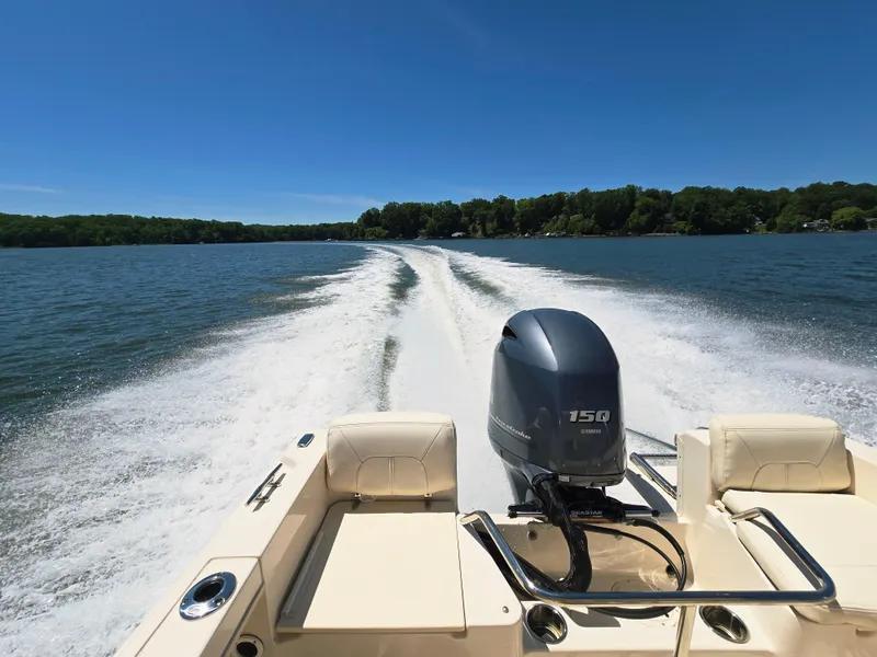 Slide: The Image of 2023 Grady-White Fisherman 180 boat cruising on a lake with powerful engine wake. - 21