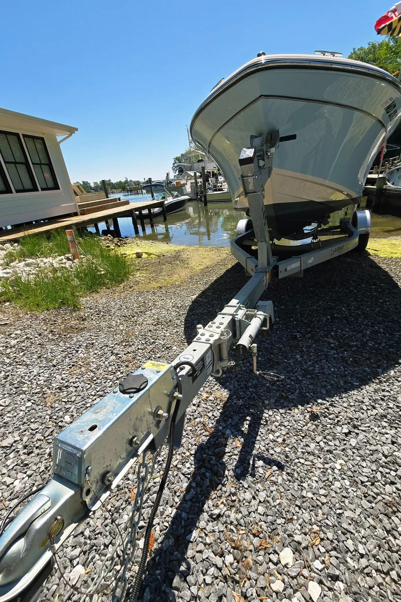 Slide: The Image of 2023 Grady-White Fisherman 180 boat on trailer, parked near waterfront. - 24