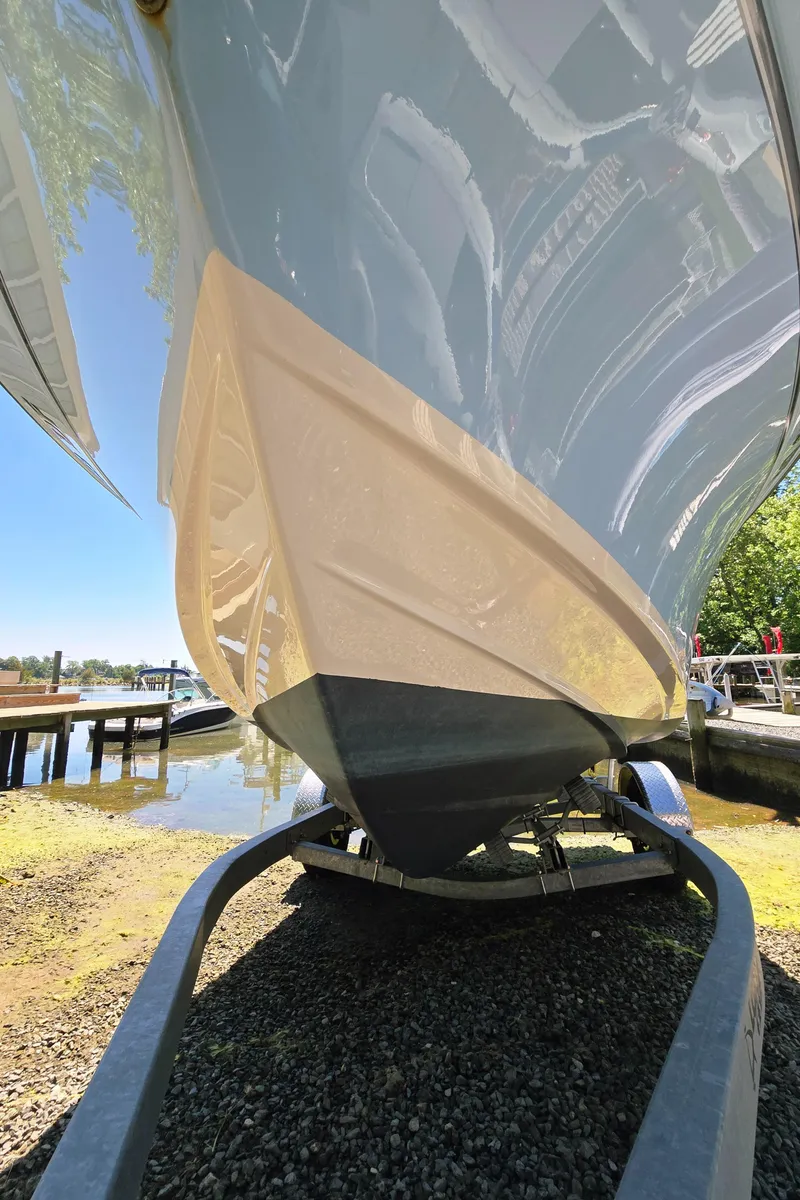 Slide: The Image of 2023 Grady-White Fisherman 180 boat on trailer, dockside view. - 26