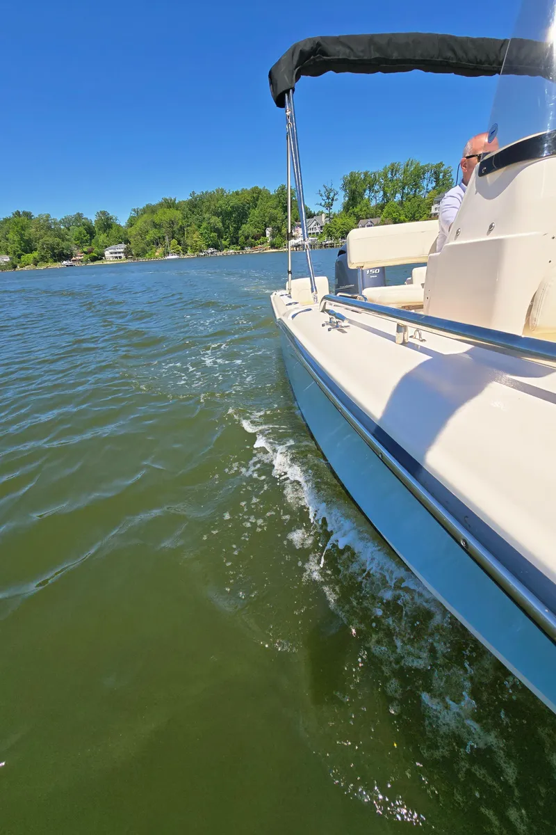 Slide: The Image of 2023 Grady-White Fisherman 180 boat cruising on a sunny lake. - 28