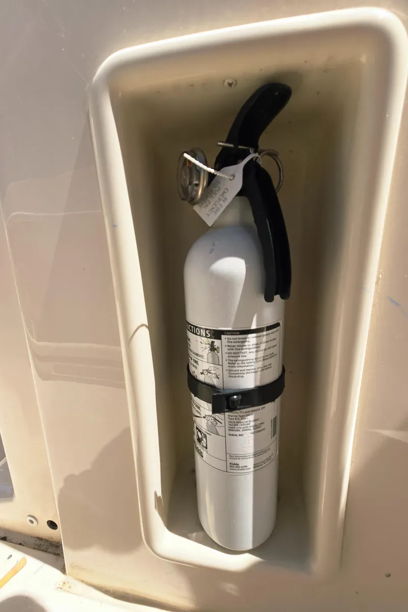 Slide: The Image of Fire extinguisher mounted on 2023 Grady-White Fisherman 180 boat. - 29