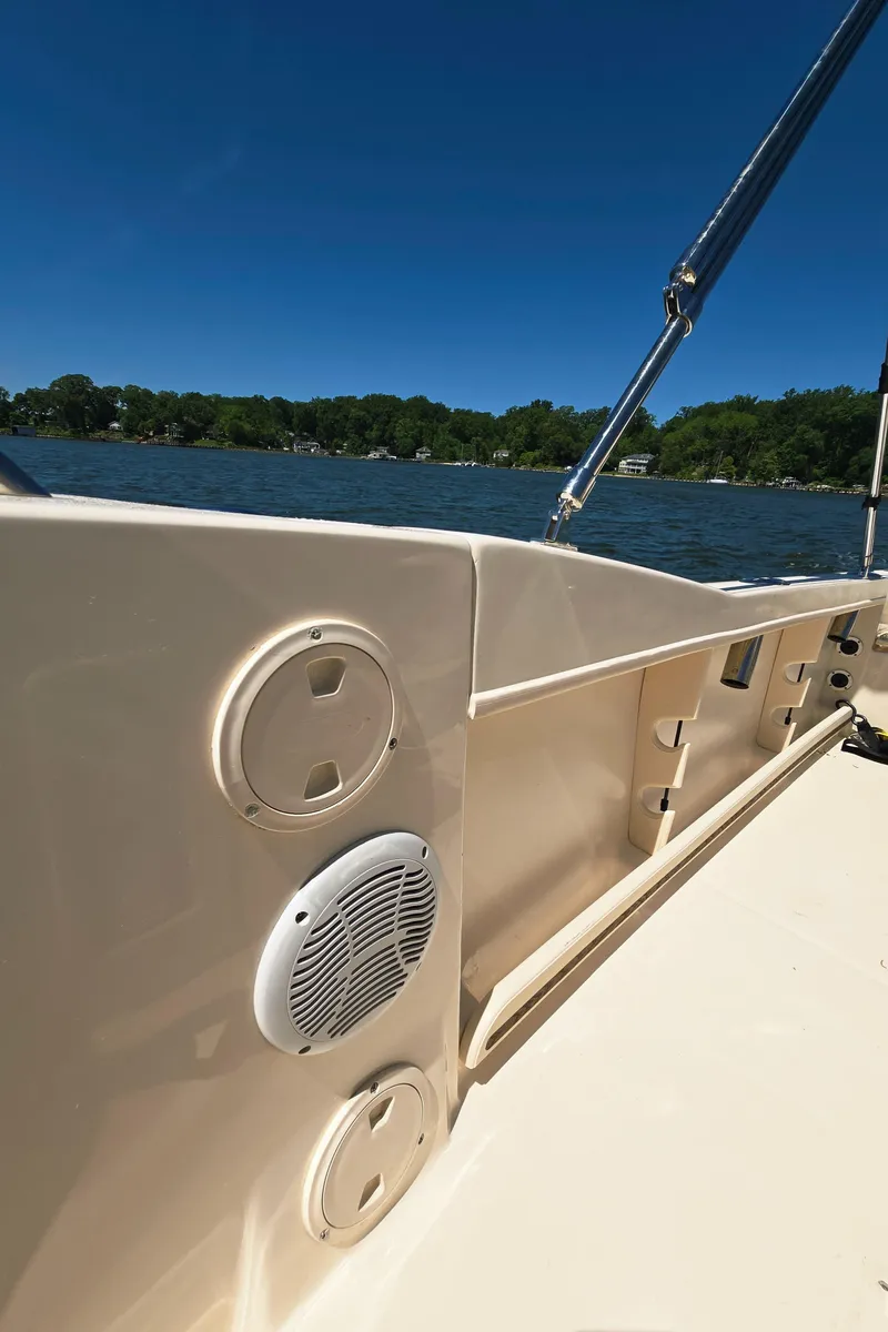 Slide: The Image of 2023 Grady-White Fisherman 180 boat interior with speakers, on a sunny day. - 31