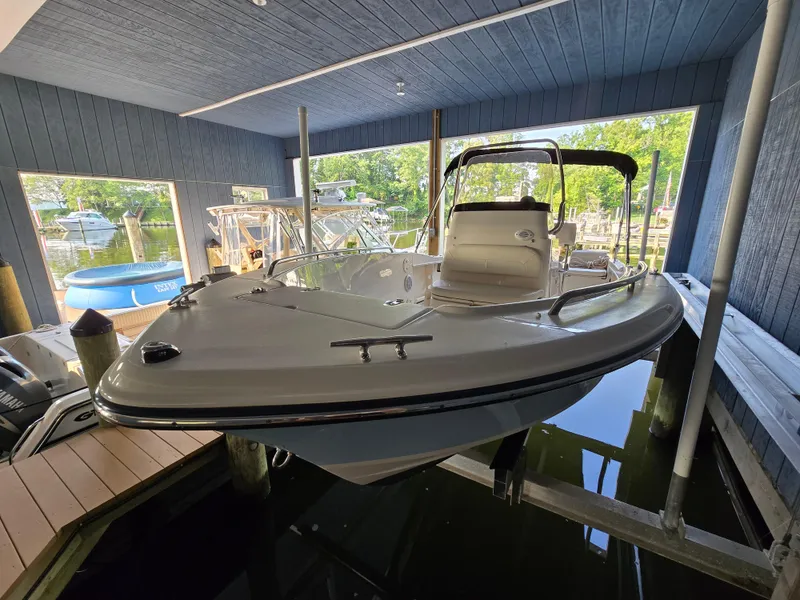 Slide: The Image of 2023 Grady-White Fisherman 180 boat docked in a covered marina. - 34