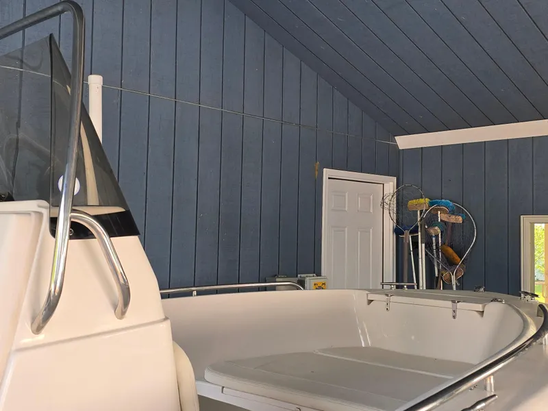 Slide: The Image of 2023 Grady-White Fisherman 180 boat in a blue-walled garage. - 41