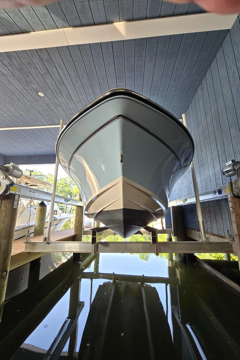 Slide: The Image of 2023 Grady-White Fisherman 180 boat docked in a covered marina. - 44