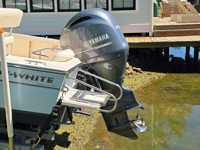 Slide: The Image of 2023 Grady-White Fisherman 180 with Yamaha outboard motor near dock. - 5