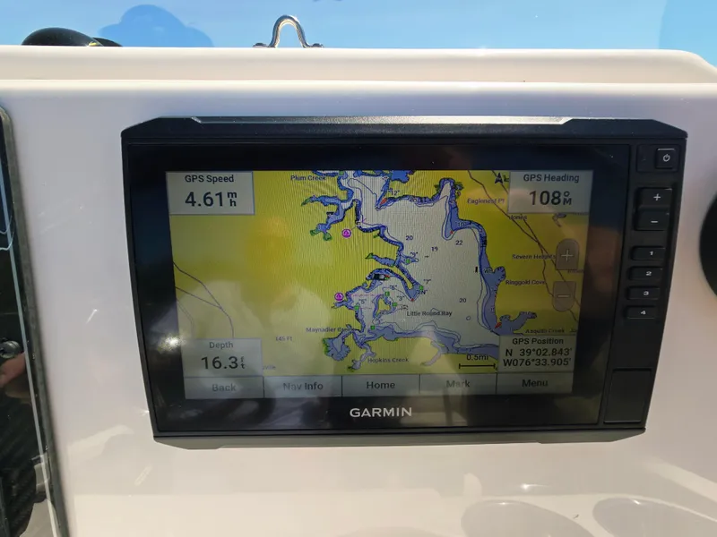 Slide: The Image of Garmin GPS display on 2023 Grady-White Fisherman 180 boat, showing navigation map and speed. - 9