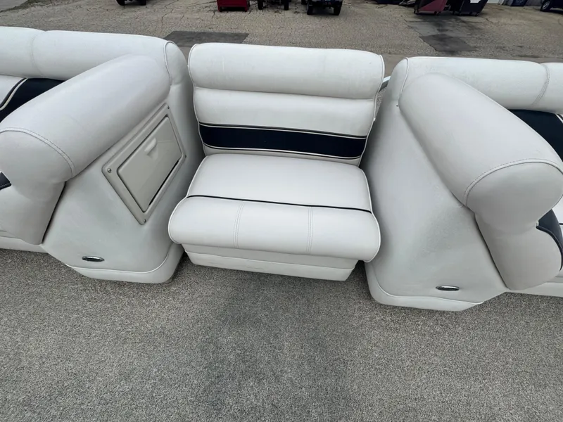 Slide: The Image of White seating on 2007 Premier Grand Majestic 22 boat, featuring storage compartment. - 10
