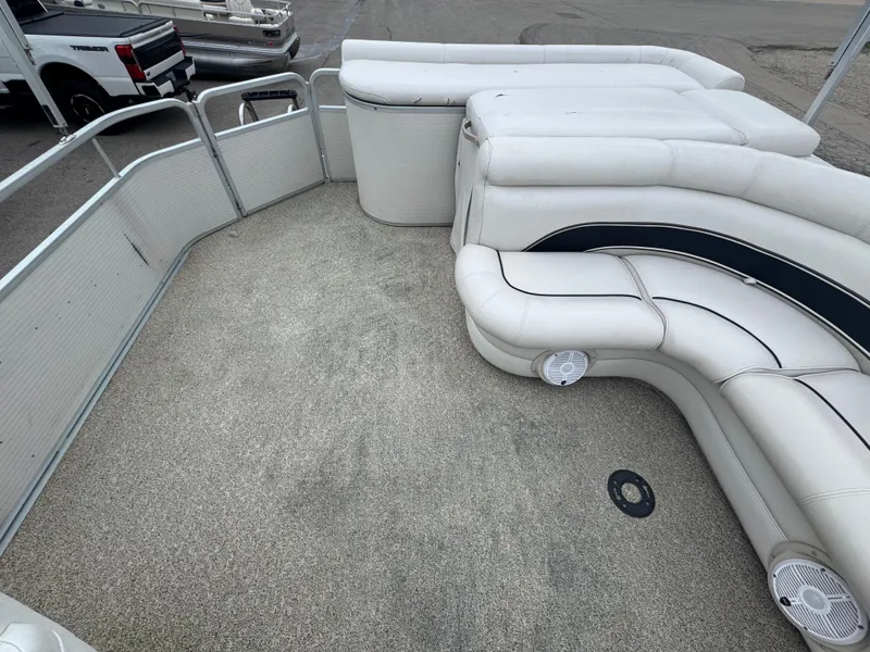 Slide: The Image of 2007 Premier Grand Majestic 22 pontoon boat interior with white seating and carpeted floor. - 15