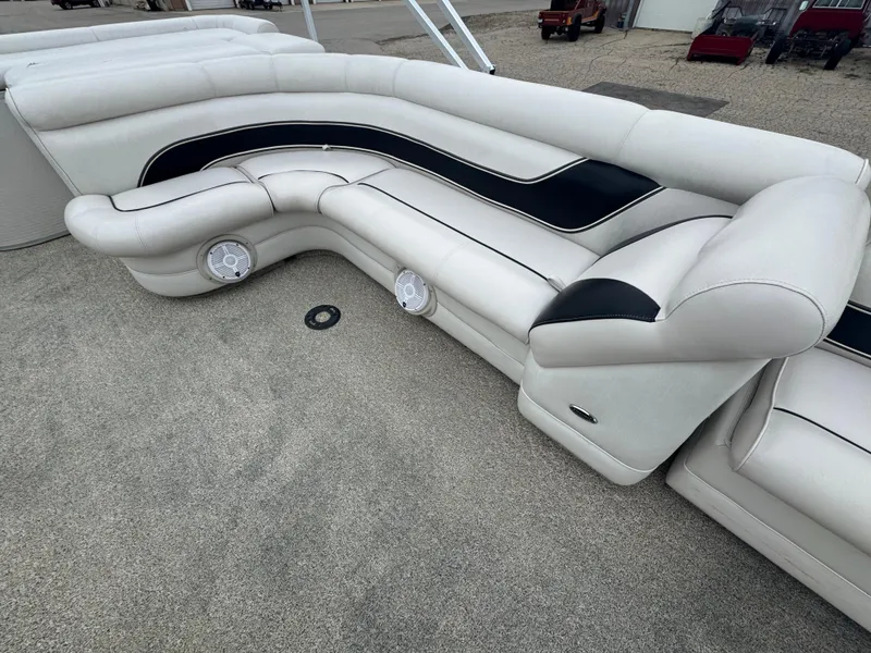 Slide: The Image of Luxurious seating on a 2007 Premier Grand Majestic 22 pontoon boat with integrated speakers. - 16