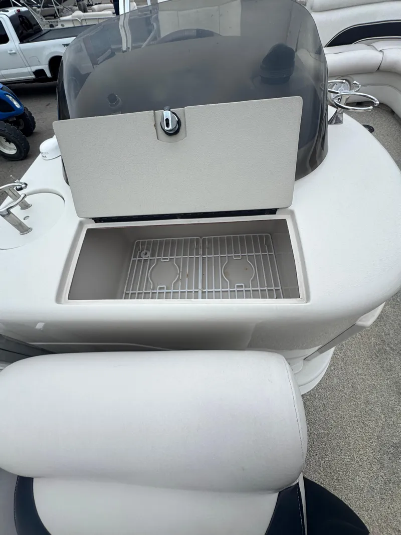 Slide: The Image of 2007 Premier Grand Majestic 22 boat with open storage compartment and seating. - 8