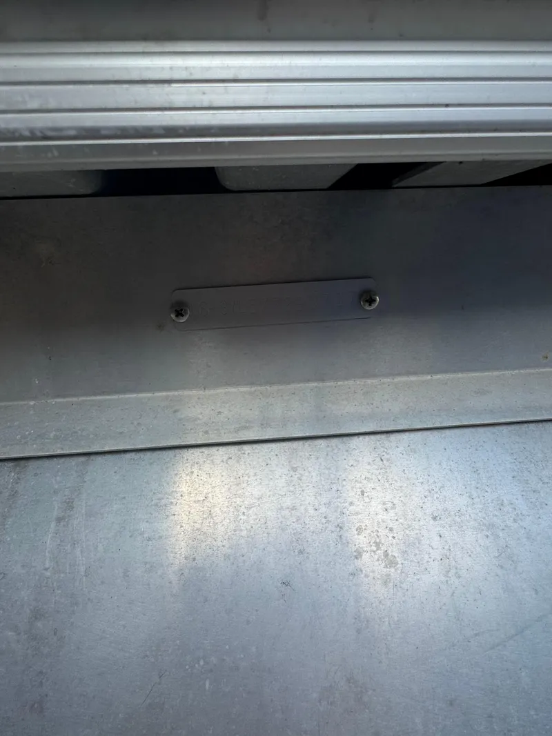 Slide: The Image of Close-up of a 2017 Sylvan Mirage 818 Cruiser's metallic surface detail. - 13