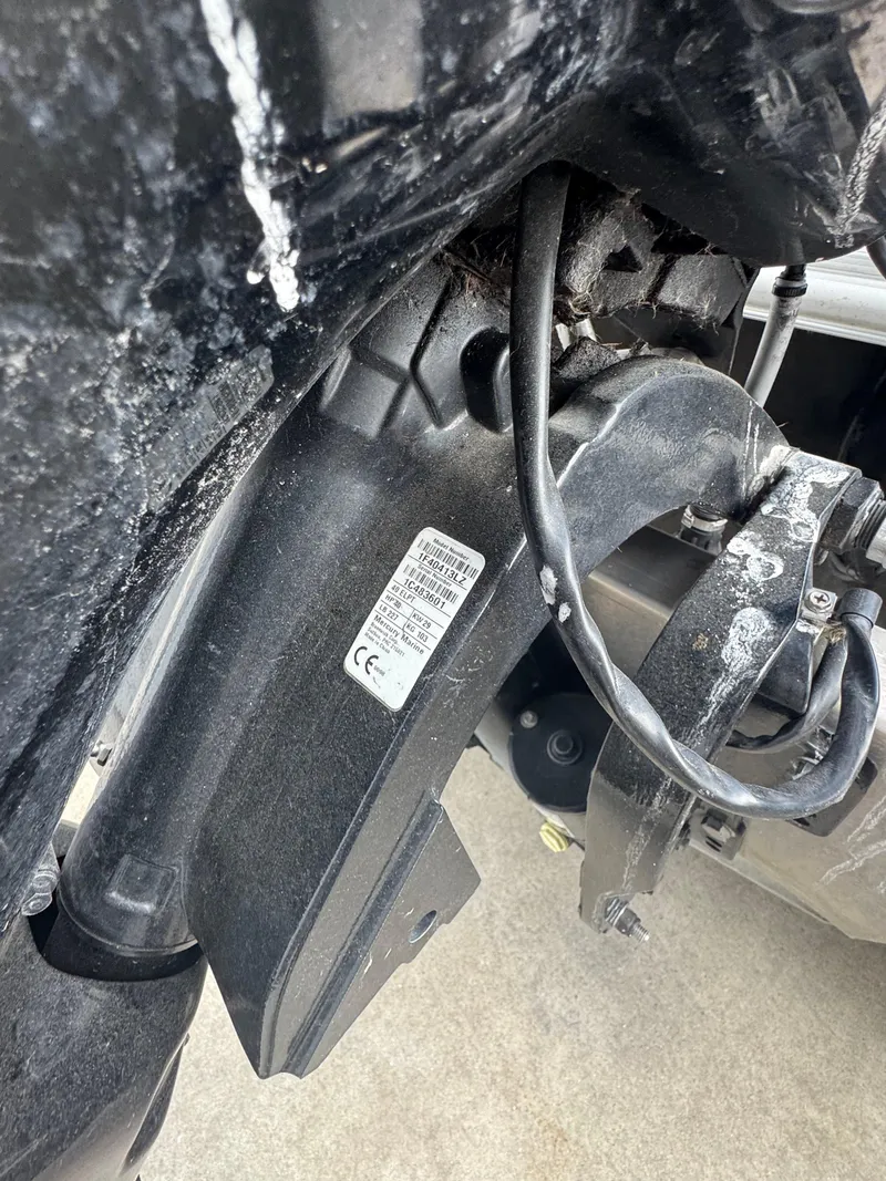 Slide: The Image of Close-up of 2017 Sylvan Mirage 818 Cruiser engine component with visible wiring and label. - 14