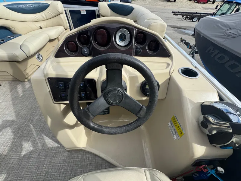 Slide: The Image of 2017 Sylvan Mirage 818 Cruiser dashboard with steering wheel and controls. - 7