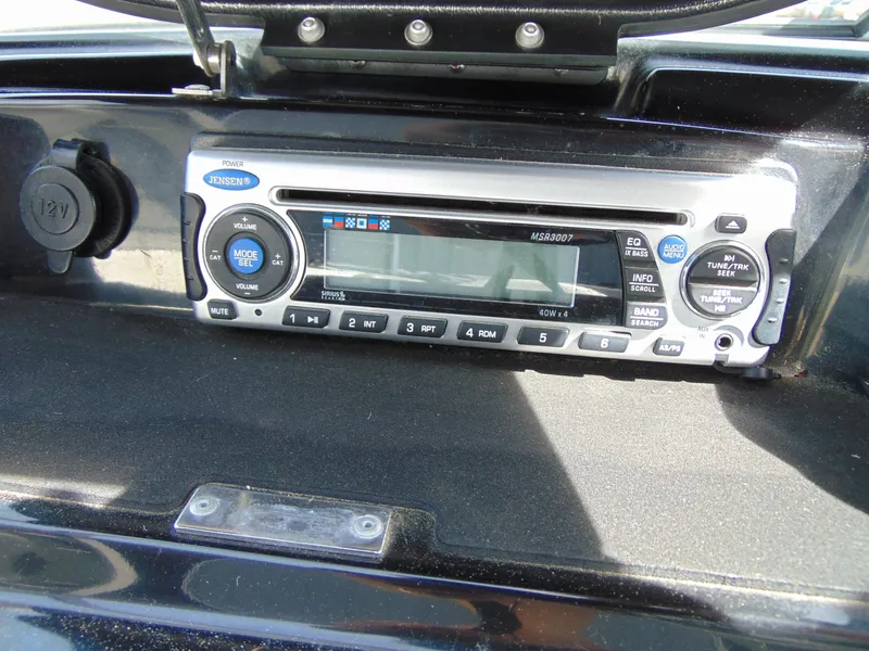 Slide: The Image of 2011 Sea-Doo 180 Challenger SE stereo system with digital display and control buttons. - 13