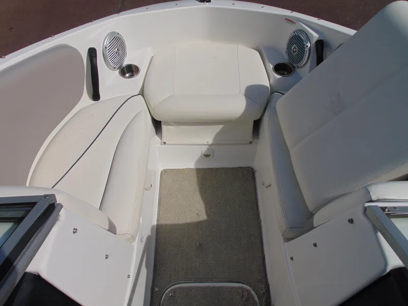Slide: The Image of 2011 Sea-Doo 180 Challenger SE boat interior with white seating and speakers. - 14