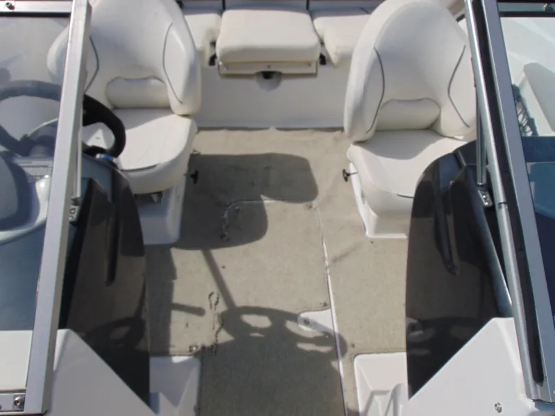 Slide: The Image of 2011 Sea-Doo 180 Challenger SE interior with dual seats and steering wheel. - 15
