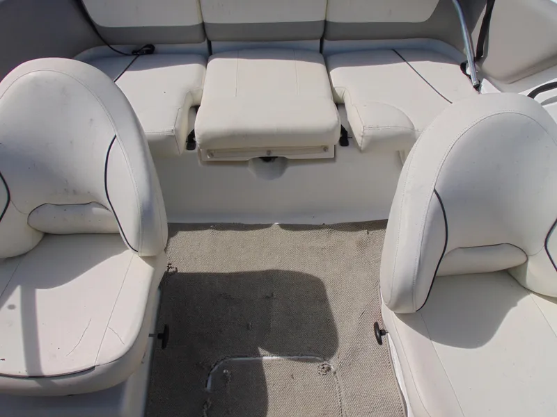 Slide: The Image of 2011 Sea-Doo 180 Challenger SE interior with white seating and carpeted floor. - 16