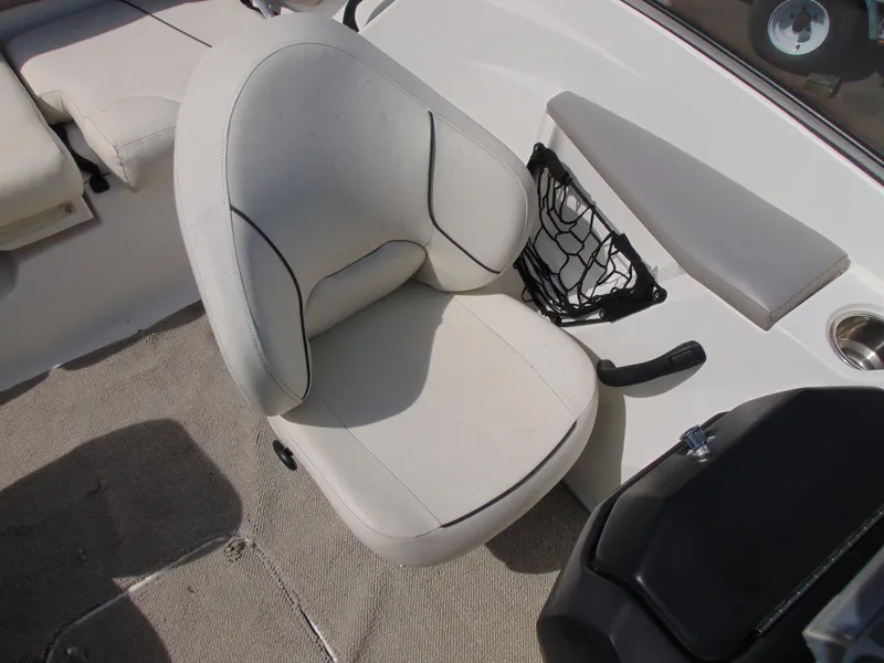 Slide: The Image of 2011 Sea-Doo 180 Challenger SE boat interior with white seating and storage net. - 18