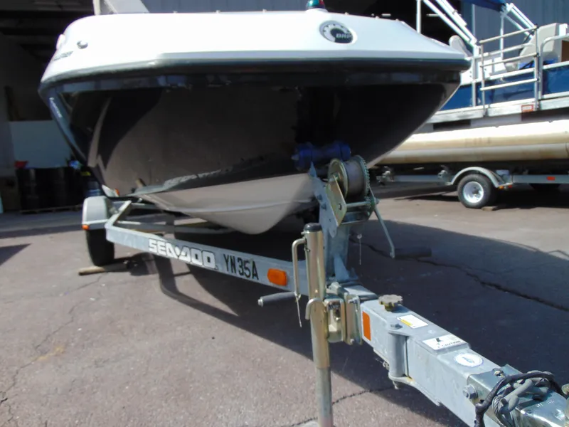 Slide: The Image of 2011 Sea-Doo 180 Challenger SE on trailer, parked outdoors. - 24