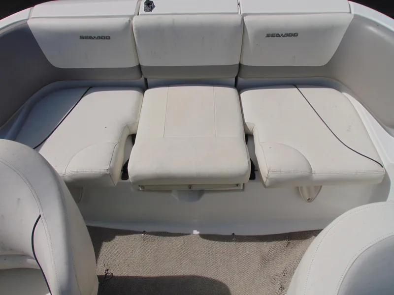 Slide: The Image of 2011 Sea-Doo 180 Challenger SE boat interior with white seating. - 5