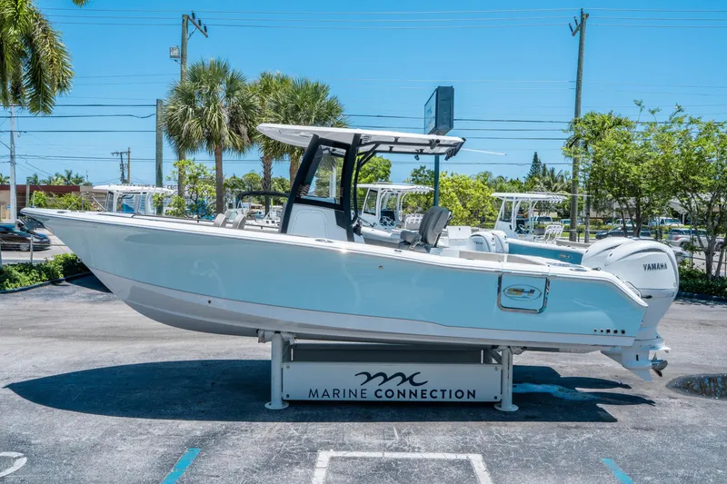 Slide: The Image of 2025 Sea Hunt Gamefish 25 boat displayed at Marine Connection dealership. - 5